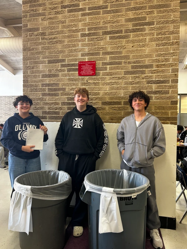 Aaron, Michael, and Jackson performing a trash audit