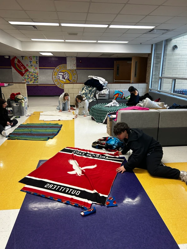 Students creating blankets with donated fabric for the Verdance for Veterans initiative