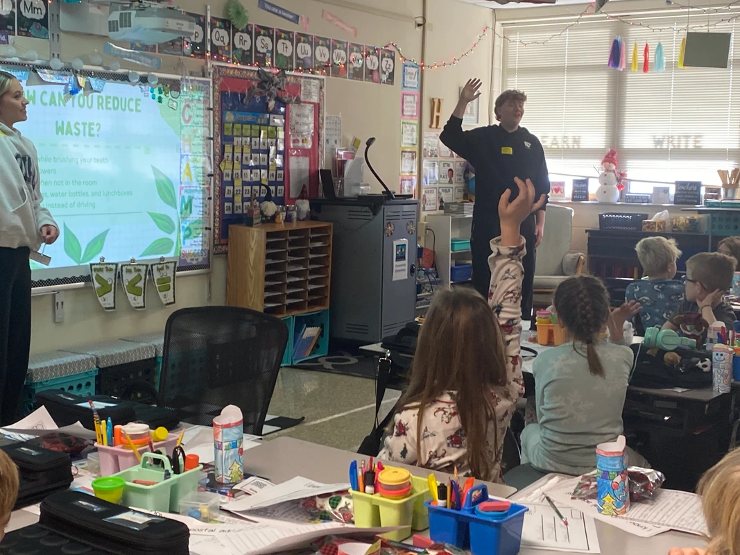 Student volunteers presenting to Robert Crown students