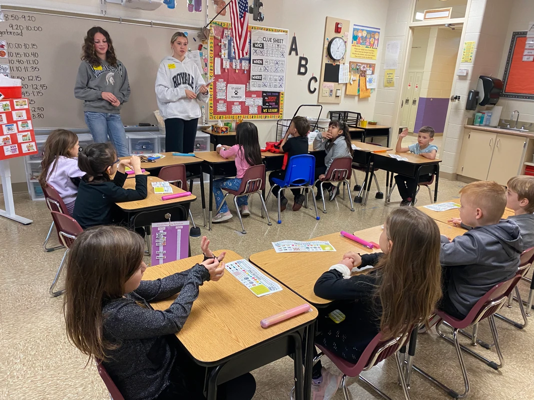Student volunteers speaking to Robert Crown students