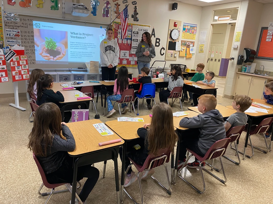 Student volunteers presenting to Robert Crown students