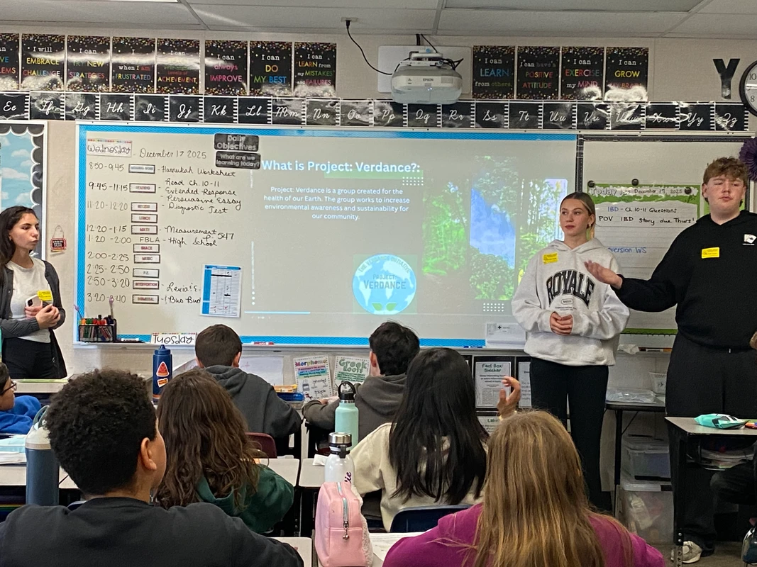 Student volunteers presenting to Robert Crown students