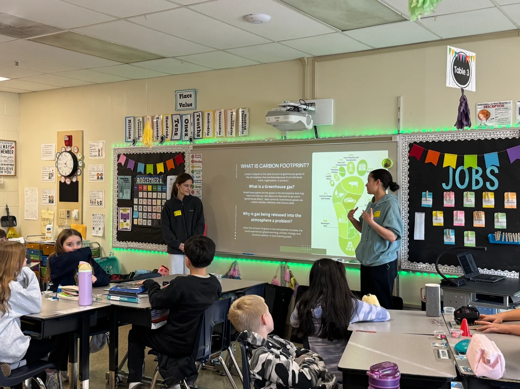 Student volunteers presenting to Robert Crown students