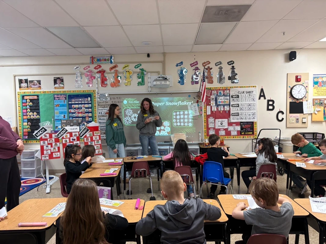 Student volunteers presenting to Robert Crown students