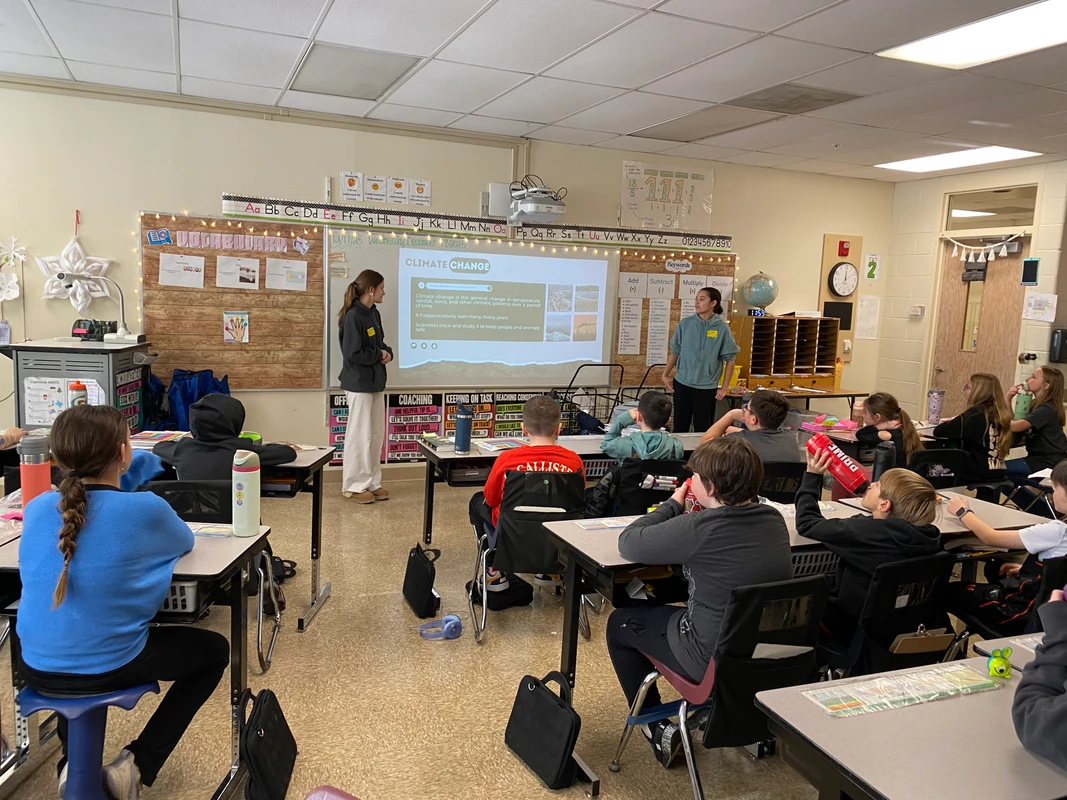 Student volunteers presenting to Robert Crown students